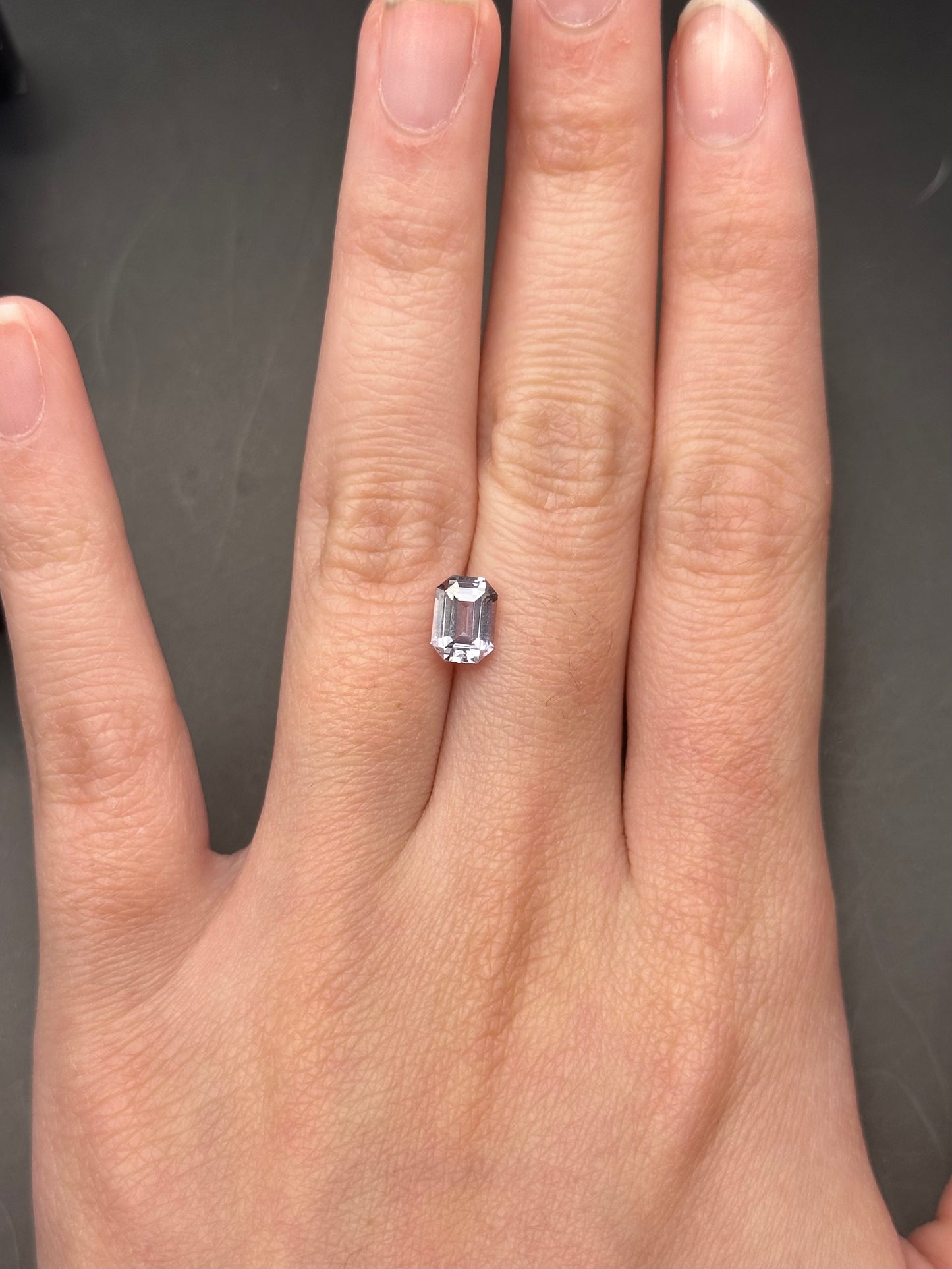 greyish white emerald cut sapphire - 1.25 ct